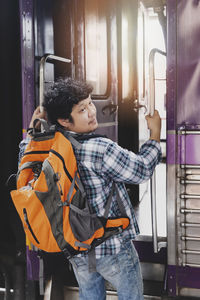 Portrait of young woman sitting in bus