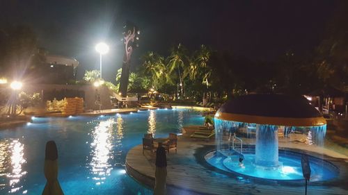 Illuminated swimming pool at night