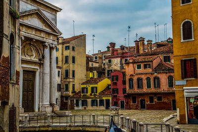 Low angle view of buildings in city against sky