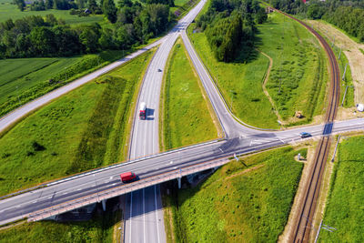 High angle view of highway amidst plants in city