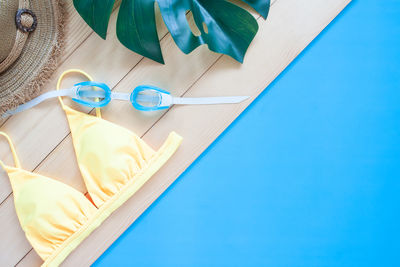 High angle view of blue and book on table