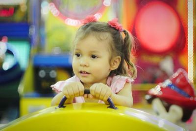 Close-up of cute girl on ride