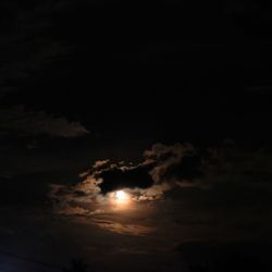 Low angle view of moon in sky at night