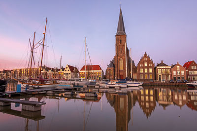 View on st. michaels church in the city harlingen in friesland the netherlands at sunset