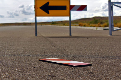 Broken road sign
