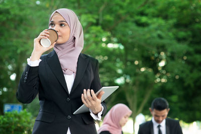Woman using mobile phone outdoors