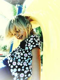 Close-up of smiling girl playing