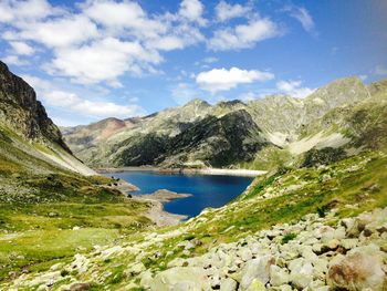 Scenic view of lake and mountains against sky