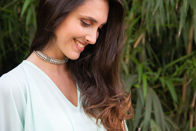 Close-up of young woman looking away