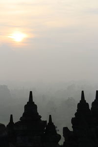 Panoramic view of temple against sky during sunset