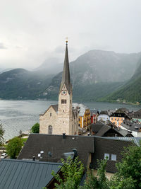 Buildings against sky in hallstatt village 