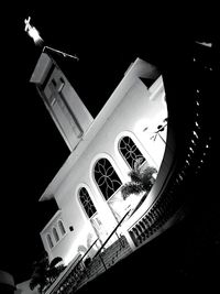 Low angle view of illuminated cathedral at night