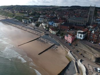 High angle view of river amidst buildings in city