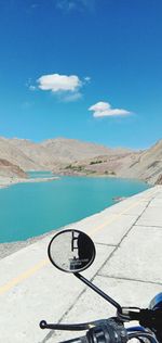 Scenic view of land against blue sky