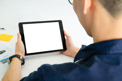 Low angle view of man using mobile phone