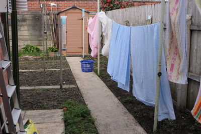 Clothes drying on clothesline outside building