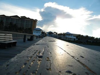 Surface level of walkway against sky