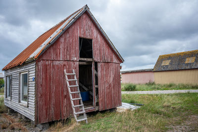 House on field against sky