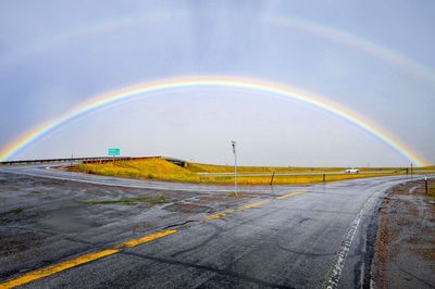 Scenic view of rainbow over road