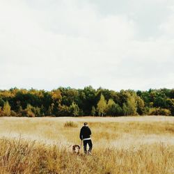 Full length of woman standing on grass