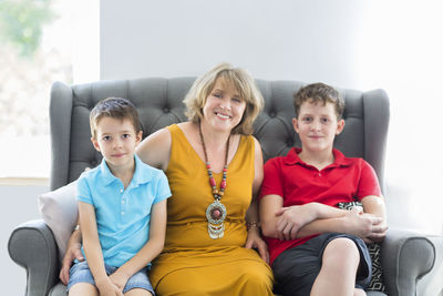 Portrait of grandmother with grandchildren at home