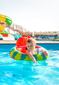 Boy swimming in pool