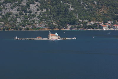 Scenic view of sea by building