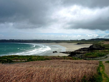 Scenic view of sea against cloudy sky