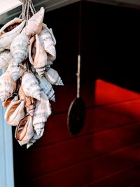 Close-up of white tied hanging on wall
