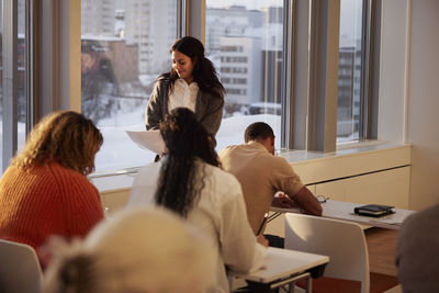 Teacher and adult students in class