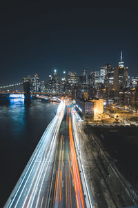 High angle view of light trails on road at night