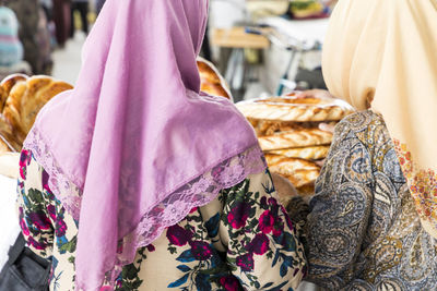 Rear view of women in hijab at market