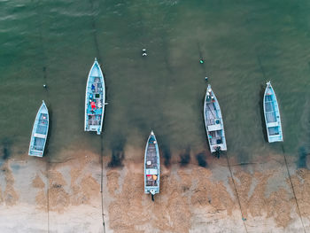 High angle view of boats moored on shore at beach