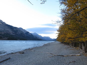 Scenic view of beach against sky during autumn