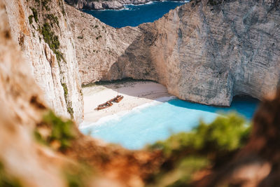 Scenic view of sea seen through rocks