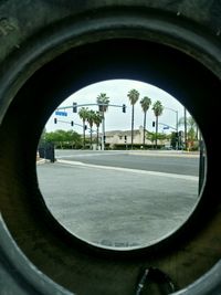 View of street seen through car window