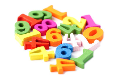 Close-up of toys over white background