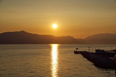 Scenic view of lake against sky during sunset