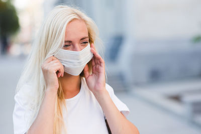 Young woman wearing mask