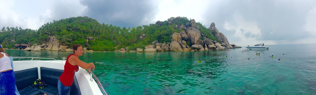 water, sky, sea, nautical vessel, scenics, tranquility, tranquil scene, beauty in nature, boat, cloud - sky, nature, transportation, mountain, cloud, horizon over water, mode of transport, idyllic, rock - object, panoramic, day