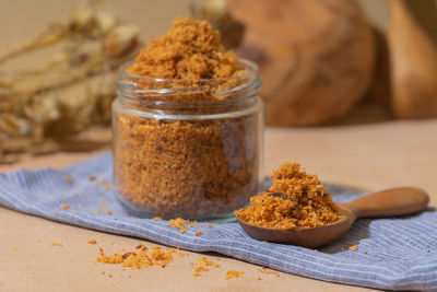 Close-up of ice cream in jar on table