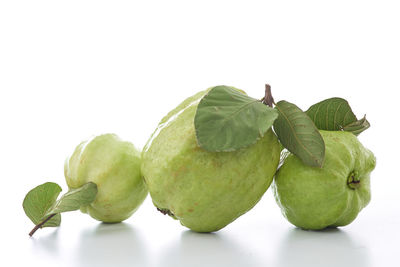 Close-up of fruits against white background