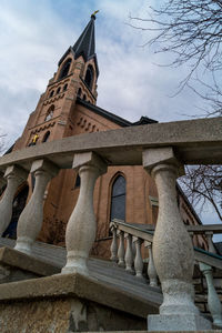 Low angle view of historical building against cloudy sky