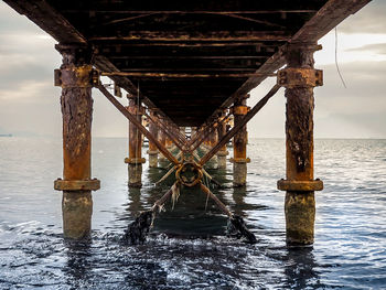 Pier over sea against sky