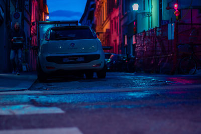 Car on city street at night