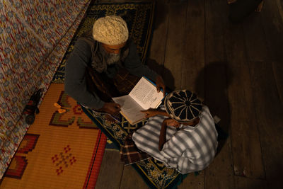 High angle view of woman reading book