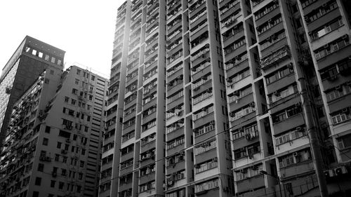 Low angle view of buildings in city against sky