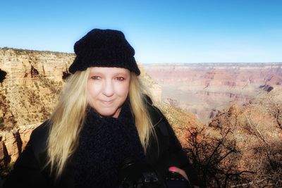 Portrait of beautiful woman against sky