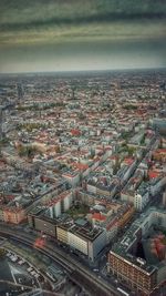 Cityscape against cloudy sky