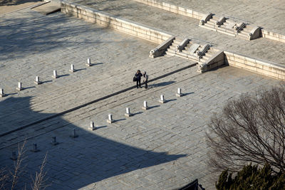 Woman standing against wall